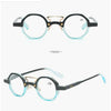 Lunettes de lecture rondes noir et bleu, vues de face et de profil.