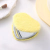 A heart-shaped foldable travel makeup mirror with a yellow fuzzy cover and silver frame.