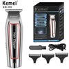 A Kemel KM-032 professional electric hair clipper with various attachments shown in a box.