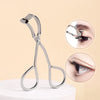 Stainless steel wide-angle eyelash curler shown with close-up views of its use on an eye