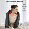 A woman is using a black U-shaped shiatsu massage device with heat for neck, back, and shoulders.
