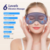 A woman is applying a multi-level vibration massage eye mask to her eyes.