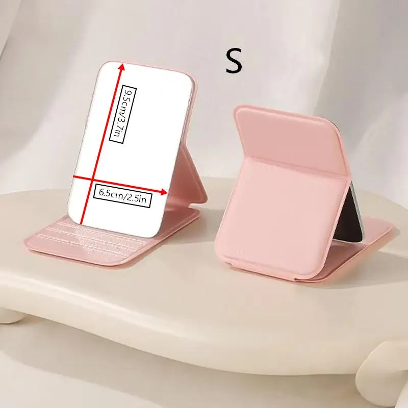 A pink foldable portable makeup mirror shown in a side view with dimension markings.