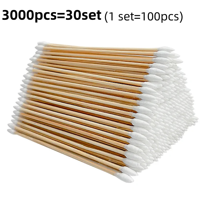 A bundle of 3000 wooden cotton swabs packaged as 30 sets, showing light brown and white tips.