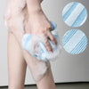 A hand is using a blue exfoliating back scrubber bath towel on a person's leg, with close-ups of the textured towel.
