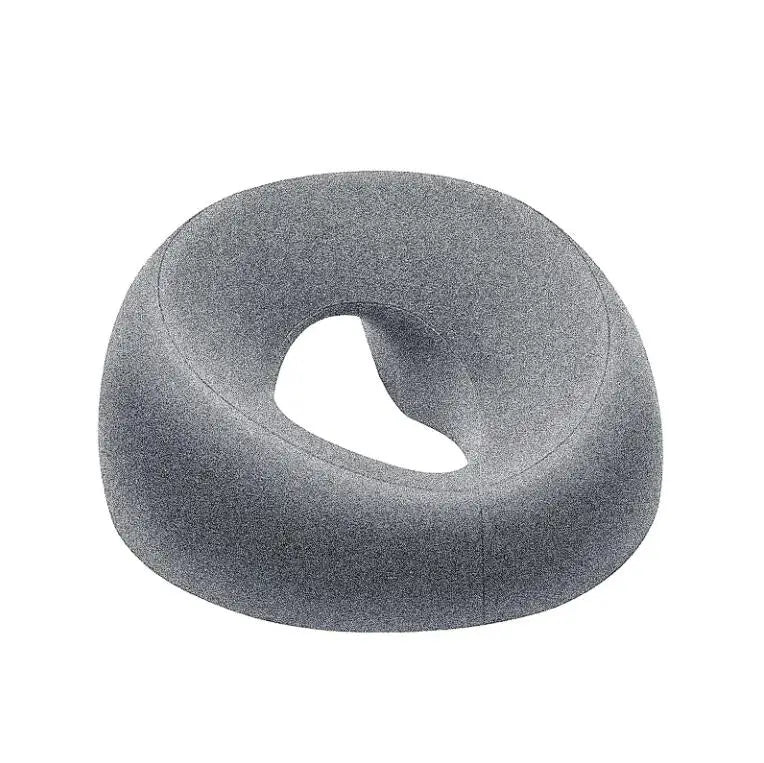 A gray ergonomic memory foam prone pillow designed for relaxation.