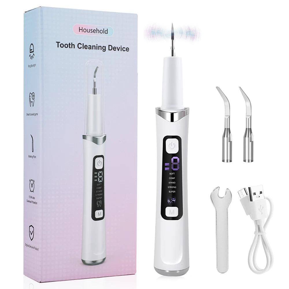 A white household tooth cleaning device with a detachable scaler and charging cable shown in its packaging.