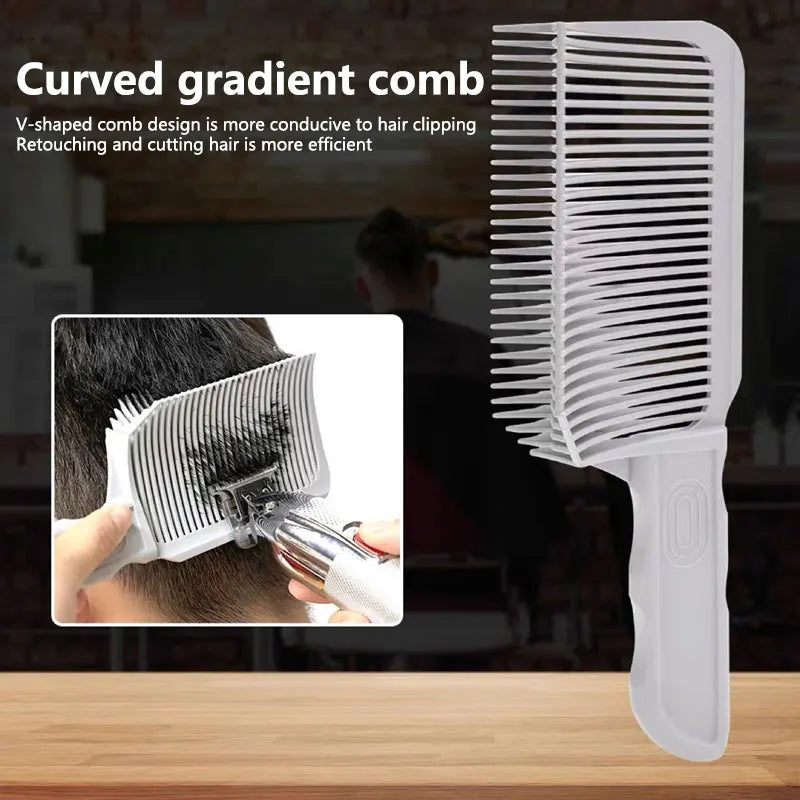 A white V-shaped curved gradient comb is shown next to a hair styling tool on a wooden surface.