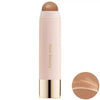 A tube of liquid bronzer contour foundation stick with a beige bullet and gold cap.