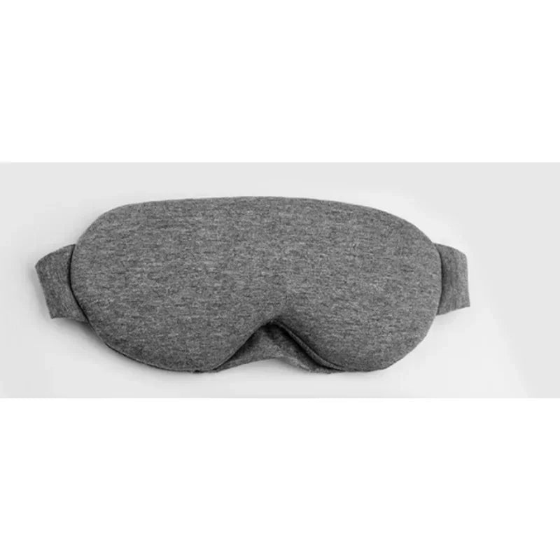 A gray comfortable 3D sleeping eye mask folded and displayed on a white background.