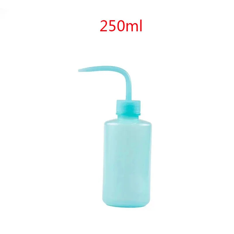 A light blue bottle of eyelash extension cleaning solution with a curved applicator brush.