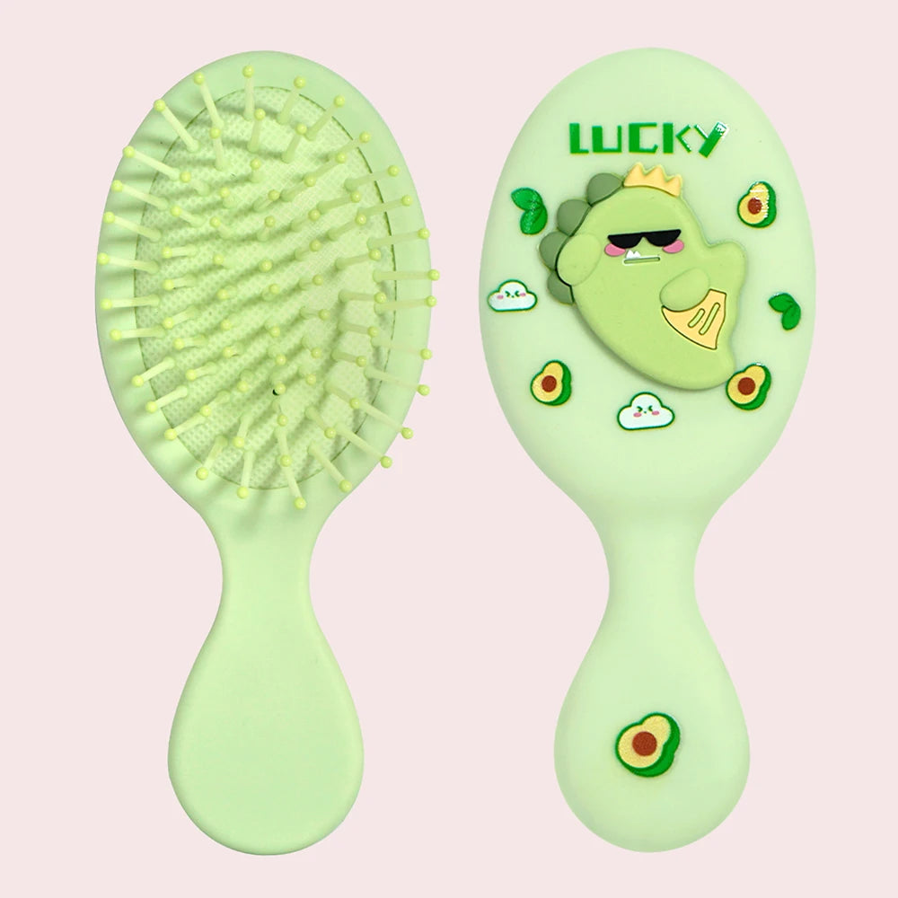 A pair of light green cartoon mini air cushion massage combs with a lucky theme and avocado accents.