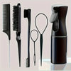 A set of six black hair styling brushes and a spray bottle displayed on a light surface.