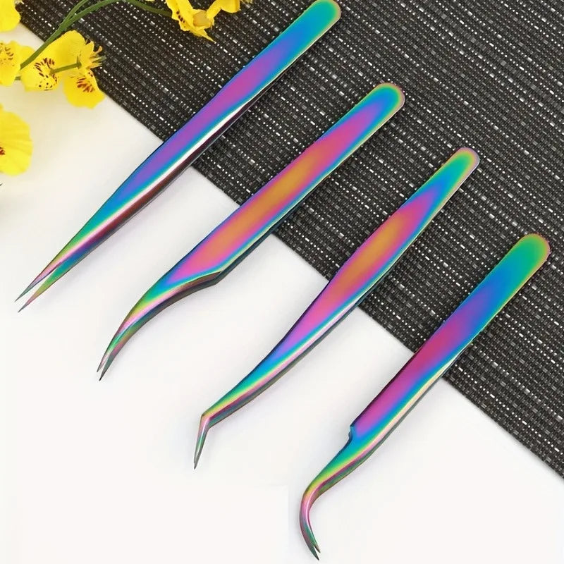 Four precision stainless steel eyelash tweezers with iridescent gradient tips resting on a dark textured surface.