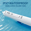 A white portable water flosser device is shown against a blue background, demonstrating its IPX7 waterproof feature.
