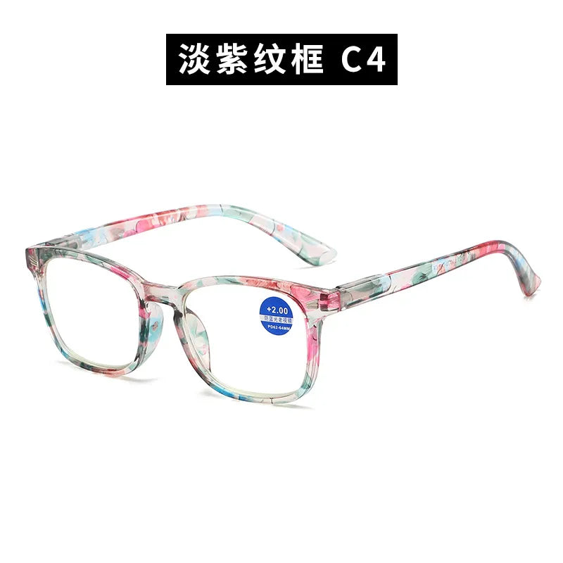 Pair of pink and green floral frame reading glasses for presbyopia