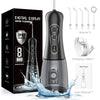 A black digital display water flosser device is shown with accessories and a charging cable on a white background.