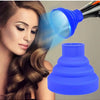 A woman is using a silicone diffuser cover for hair dryers to style her hair.