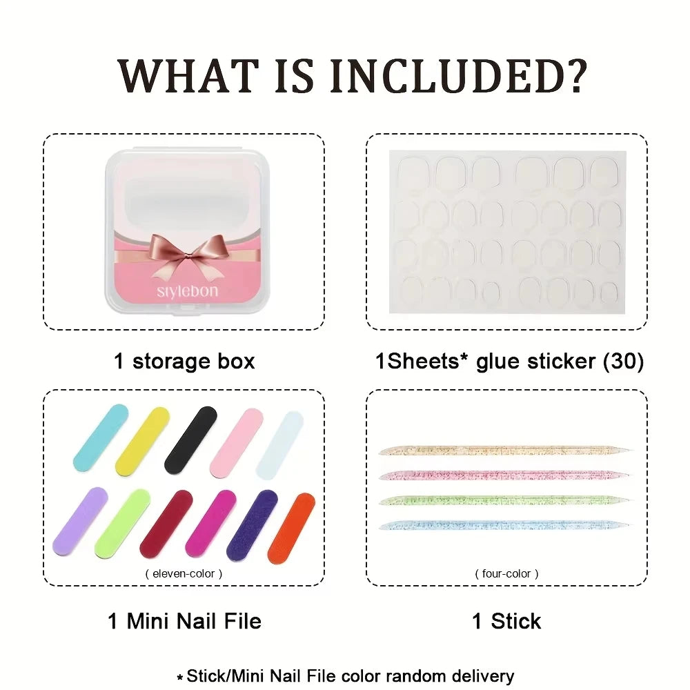 A set of pink handmade press-on nails including a storage box, glue stickers, a mini nail file, and a stick.