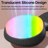 A translucent silicone facial cleansing brush emitting a multi-colored light pattern.