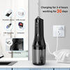 A black portable electric dental floss and oral irrigator device shown next to various charging options.
