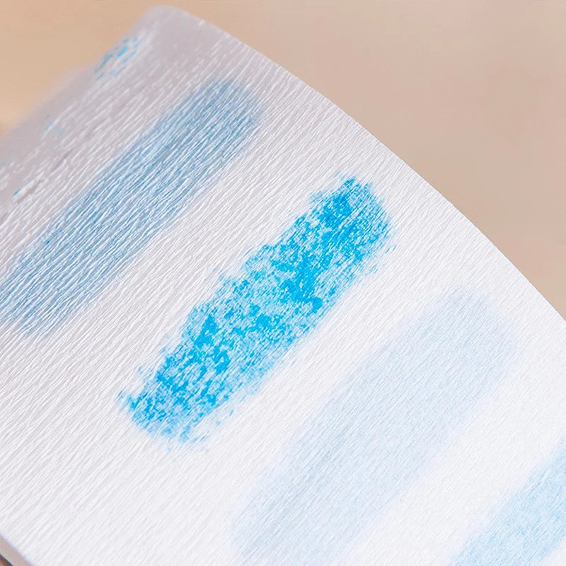 A white hair dressing collar with blue stripes is shown in a close-up view.