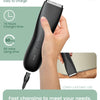 A hand holds a black USB portable charging device for an electric body shaver trimmer.