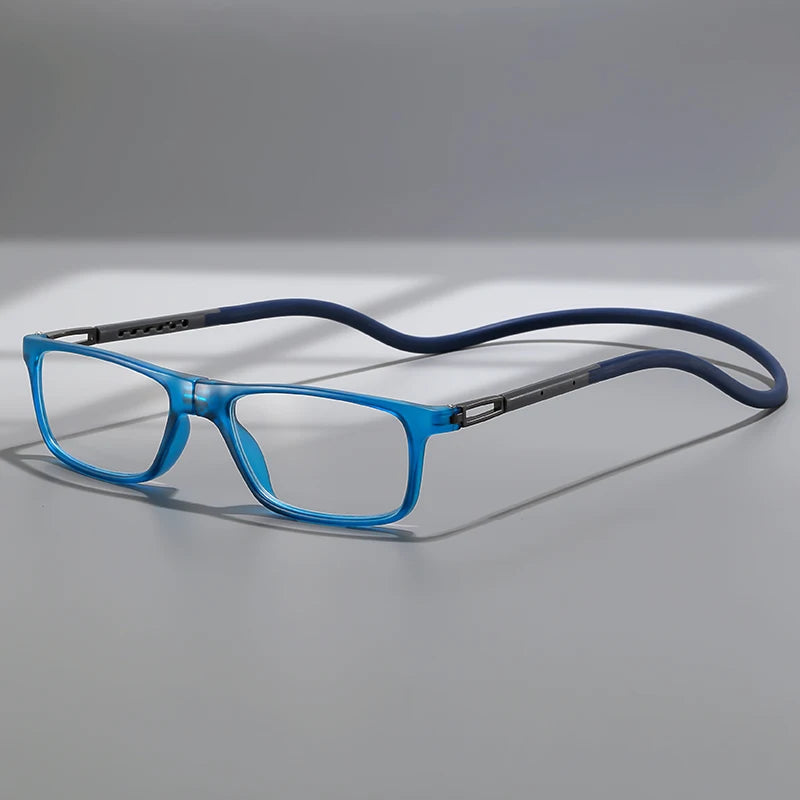 A pair of blue-framed reading glasses with silver mirror lenses resting on a gray surface.