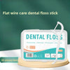 A white plastic case holds a flat wire dental floss stick and various cleaning tools for oral hygiene.