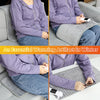 A purple electric heating pad is shown being used for muscle relief on a person's lap.
