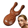 A wooden sandalwood massager comb set is shown next to a woman's face.