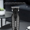 A black Kemi professional cordless hair trimmer is displayed on a dark surface.