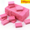 A pile of 100 pink multi-sided nail and cuticle buffing files stacked in a grid formation.
