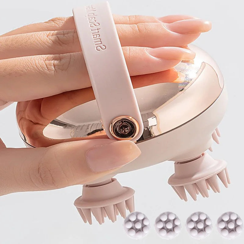 A hand is holding a pink rechargeable electric handheld scalp massager with silicone tips.