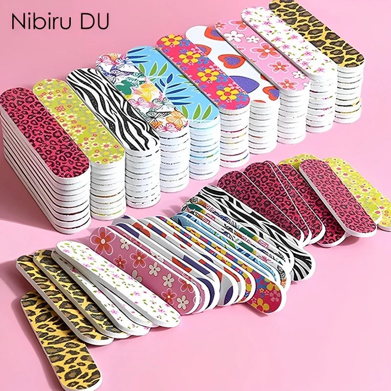 A collection of colorful double-sided nail files and buffing blocks in various patterns and colors.