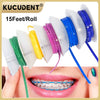 A roll of 15 feet of colored dental orthodontic power chain elastic rubber bands displayed next to a person's mouth.