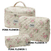 Three pink floral quilted cotton makeup bags in sizes L, M, and S shown side by side.