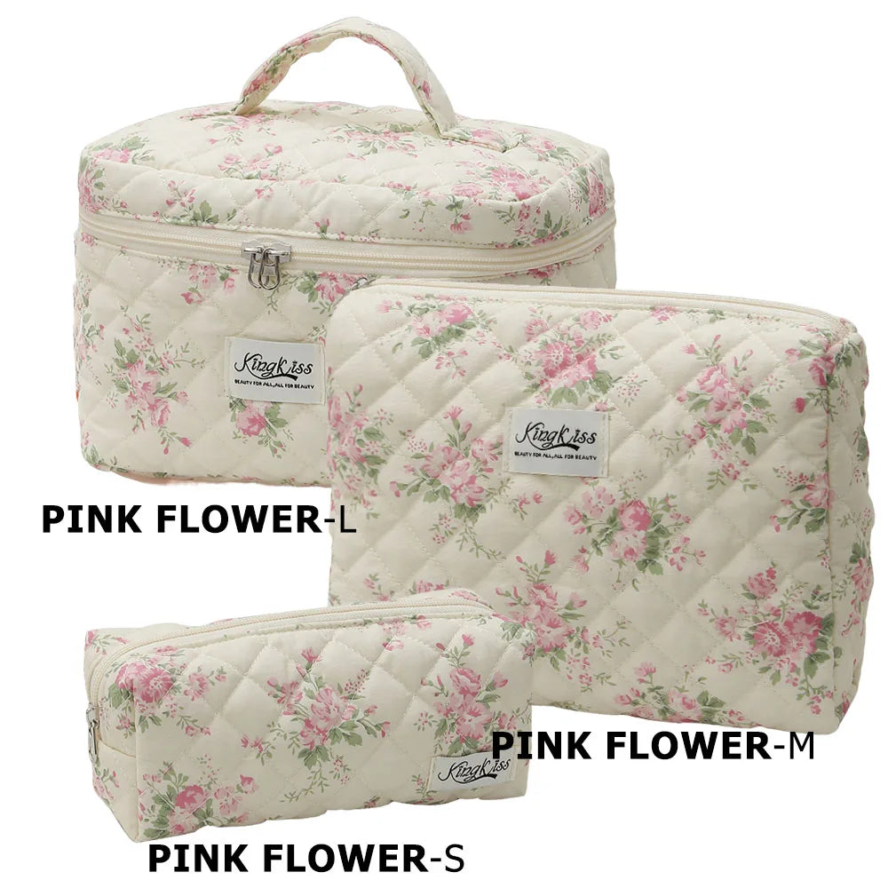 Three pink floral quilted cotton makeup bags in sizes L, M, and S shown side by side.