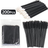 A set of 200 disposable makeup brush applicators in black and white are shown in various arrangements.