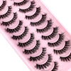 Plateau en plastique rose contenant un ensemble de faux cils de renard noirs.