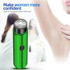A green portable electric shaver is shown next to a woman's arm, promoting confidence and clean care.