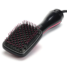 A black professional hot air hair dryer brush with numerous fine bristles and a handle is shown against a white background.