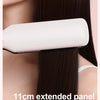 A white ceramic hair straightener panel is shown being used on long, dark hair.