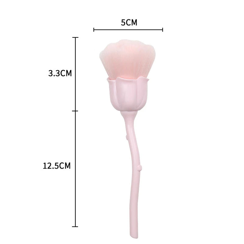 A pink rose and flower nail art dust brush set with a flared head and slender handle.