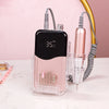 A pink cordless rechargeable nail drill with a clear housing and a metallic drill bit is shown on a white surface.