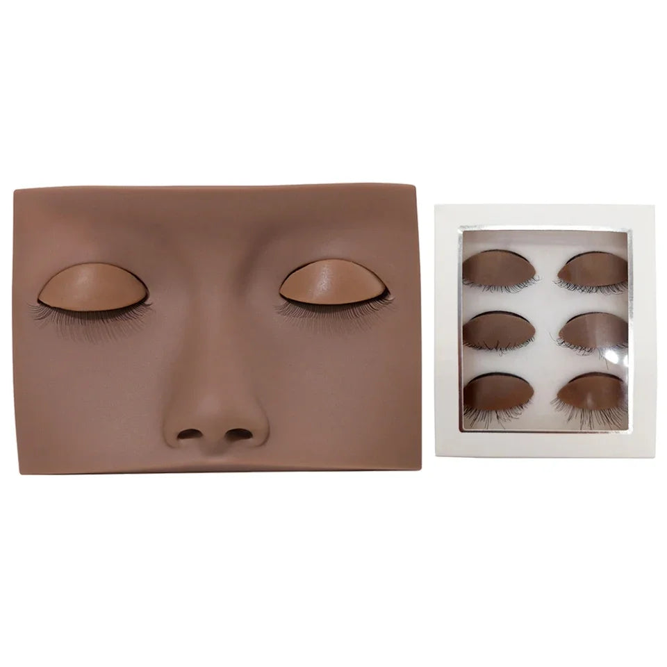 A realistic silicone mannequin head with painted eyes and lashes used for eyelash extension practice.
