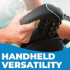 A hand is holding a black electric percussive massager with a green accent on the head.