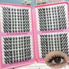 A pink plastic box containing 320 piece Korean style eyelash clusters for DIY makeup