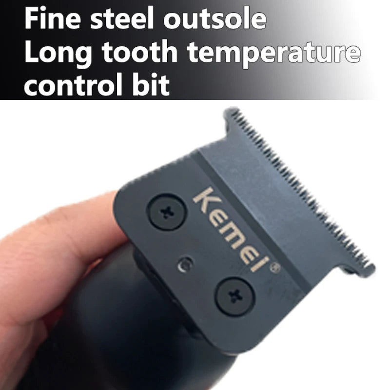 Close-up of a black Kemei fine steel outsole long tooth temperature control bit being held by a hand.