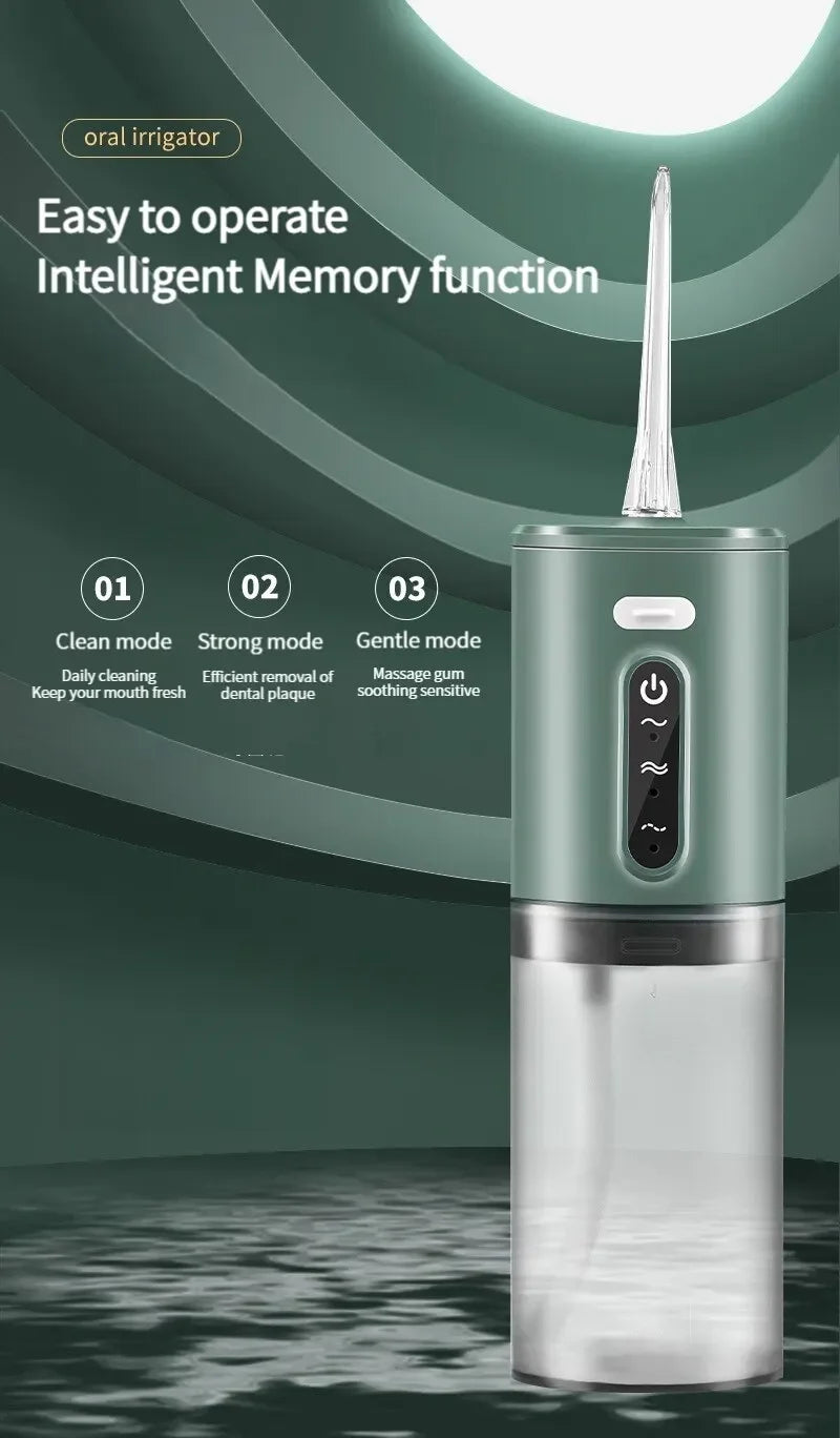 A close-up of a portable electric oral irrigator in a mint green color with a clear water reservoir.